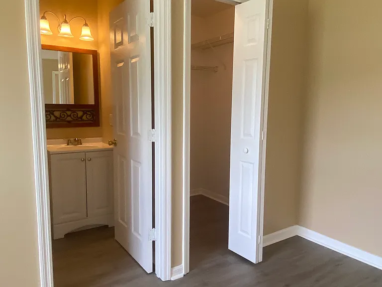 bathroom on left, walk-in closet on right