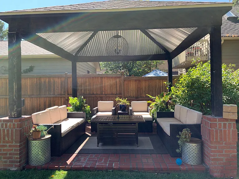Back covered patio with dining area to the right