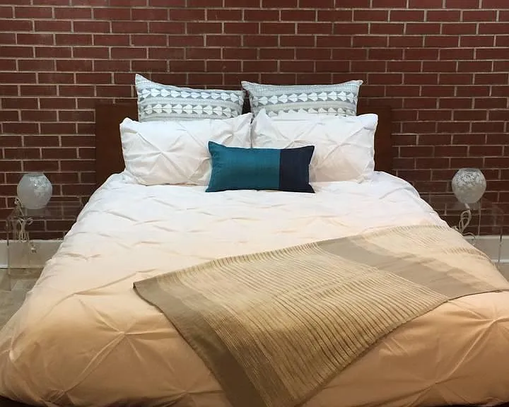 Exposed brick walls in master bedrooms