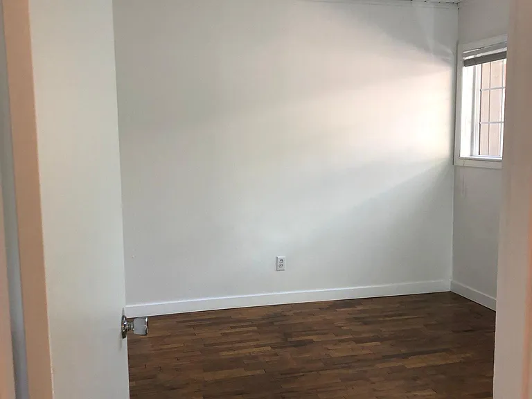 Bedroom 2 - baseboard heat will be replaced with a wall heater