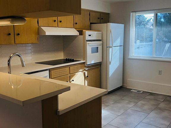Kitchen with new quartz countertops, backsplash, sink and faucet