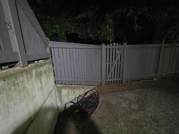 Facing gate from outside living room patio door.