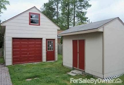 Garage and shed : One car detached garage in back yard has tons of storage space upstairs.