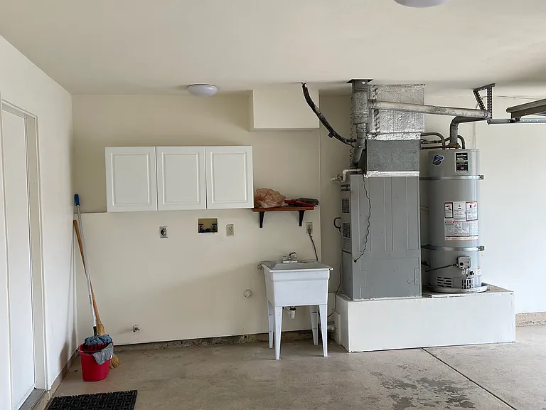 Garage with washer dryer hookup and utility sink