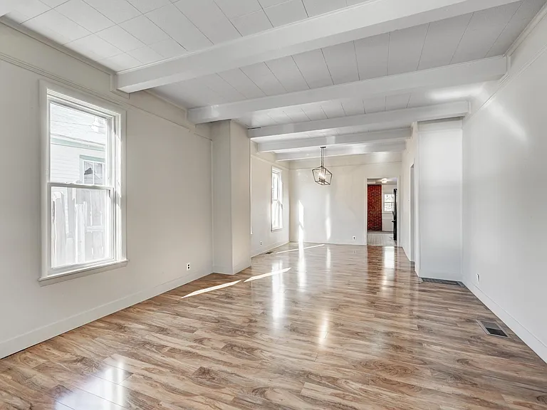 This level has new laminate flooring throughout the entry and living and dining areas and the main floor bedroom, too!