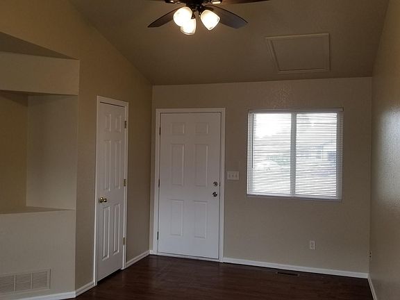Living room to front door and coat closet.
