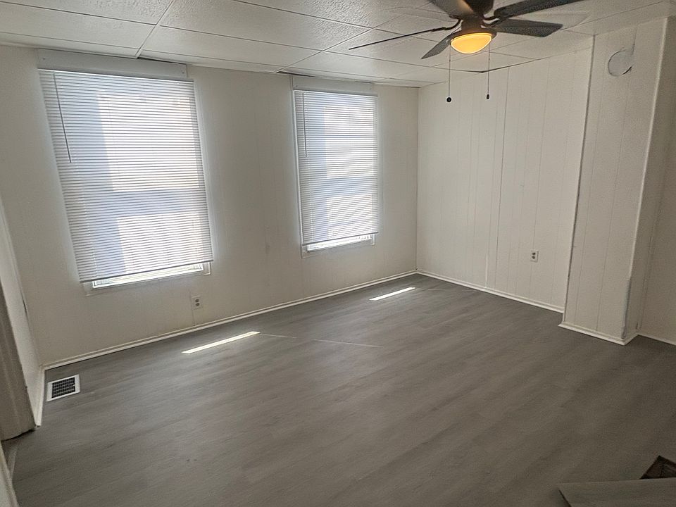 Brand new paint, vinyl flooring, ceiling fan and shades