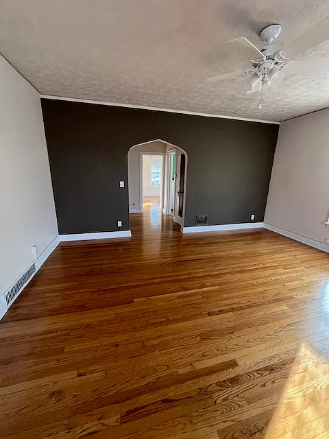 Living room. Very large and beautiful hardwood floors. - 3347 Harney St #8