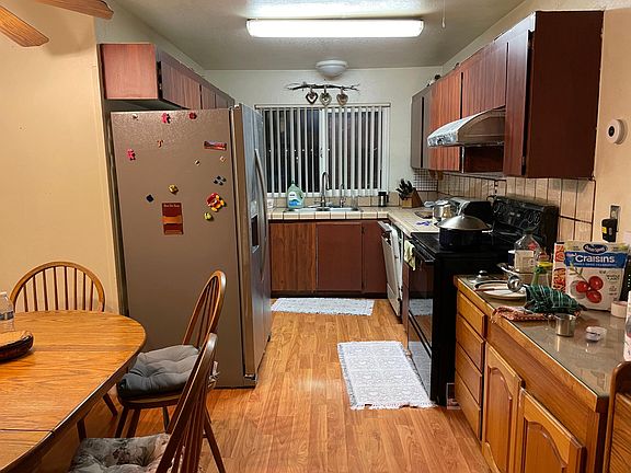 Kitchen with new refrigerator and lots of storage.
