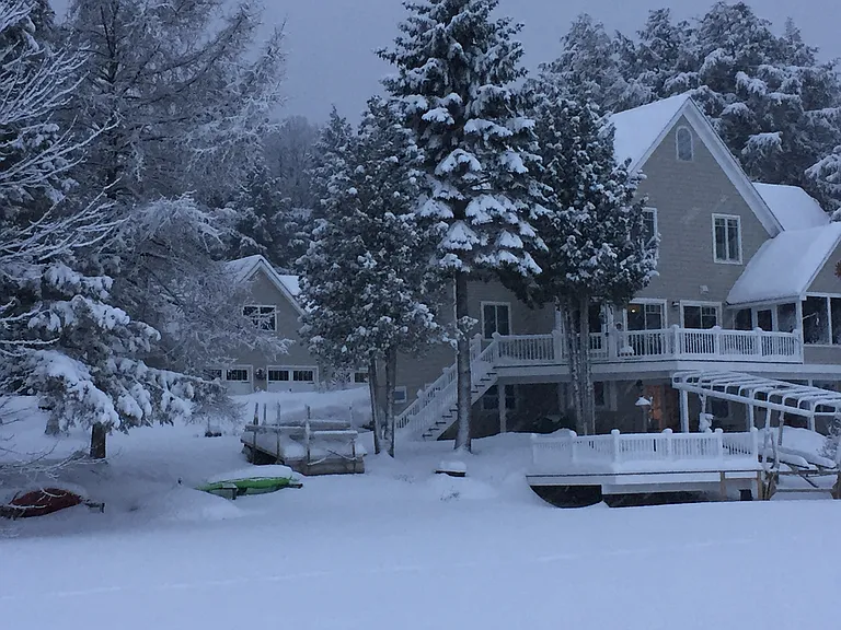 wintertime on the lake, apartment in background, over 3 car garage