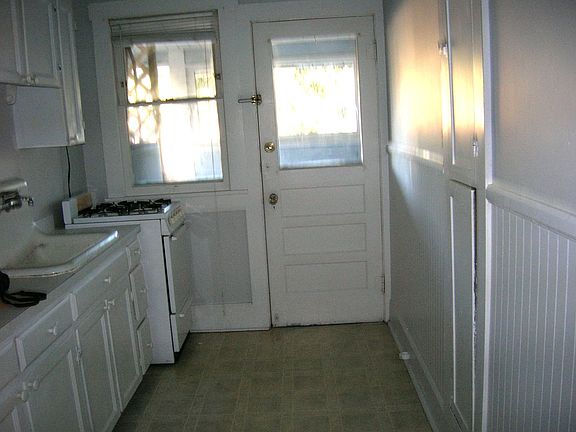 nice kitchen with built in iron board cabinet