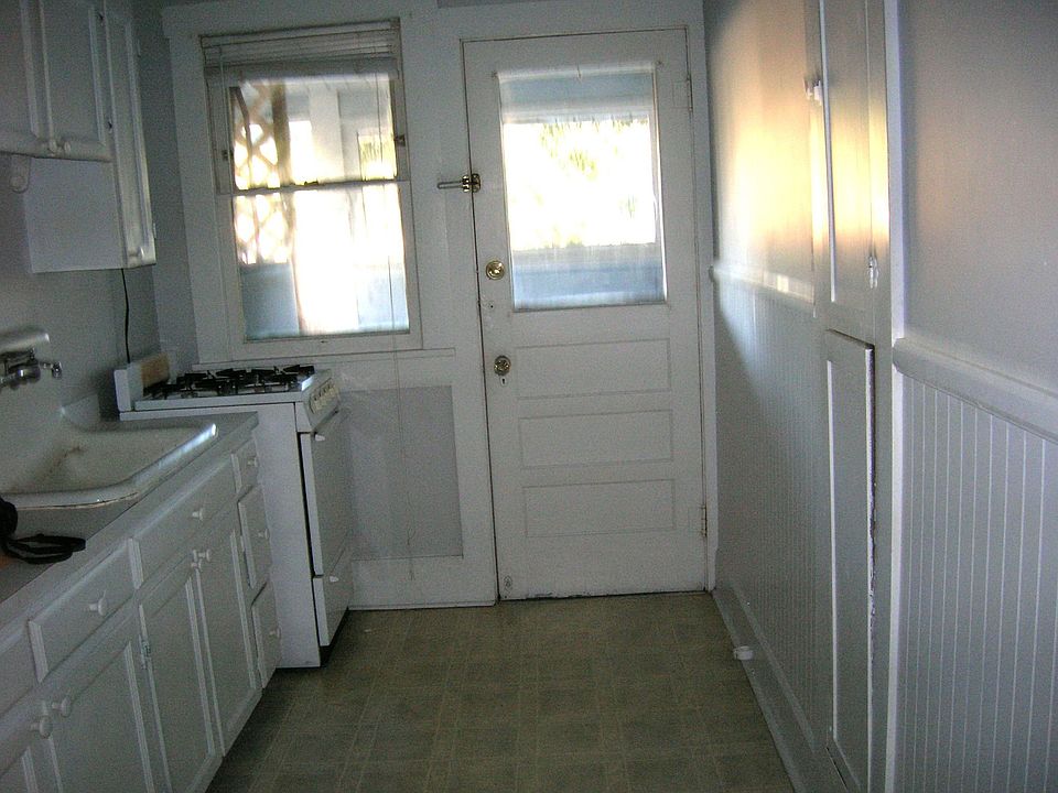 nice kitchen with built in iron board cabinet