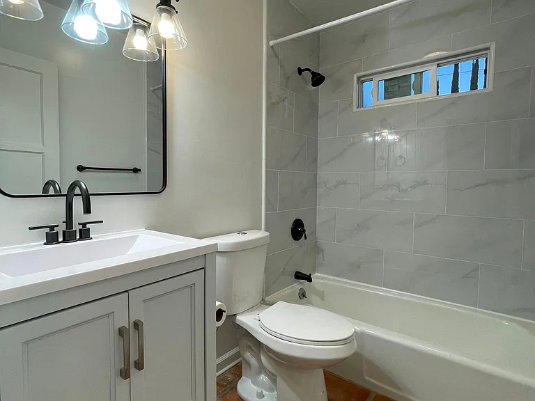 New vanity, toilet and lighting fixtures