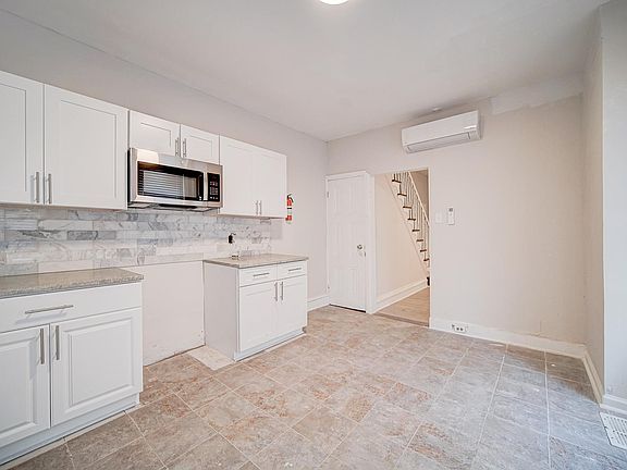 Kitchen includes a stove and fridge