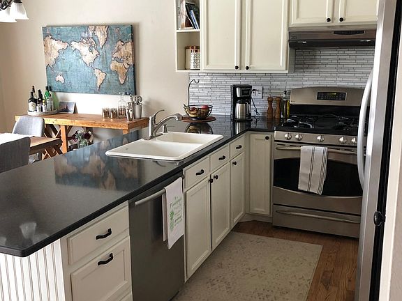 Galley style kitchen with solid surface countertop