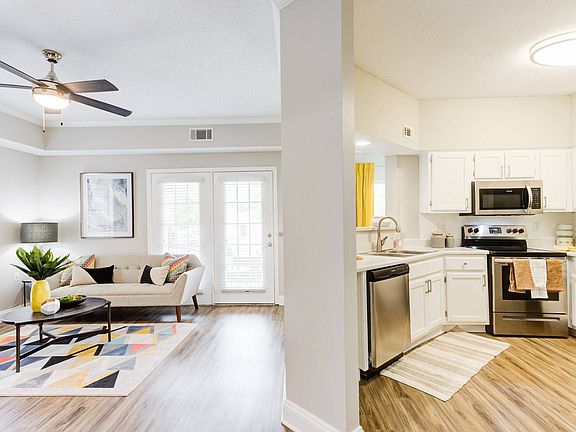 Living Room and Kitchen with Hardwood-Style Flooring