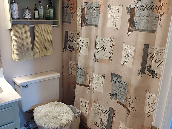 Master bath w/ tub/showe; storage closet for towels and necessities! Connected to Master Bedroom.