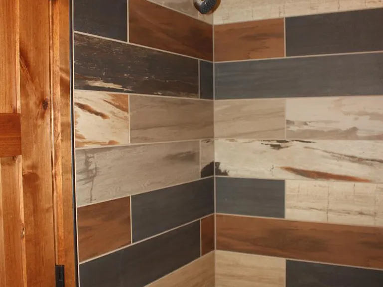 Tile surround in bath.