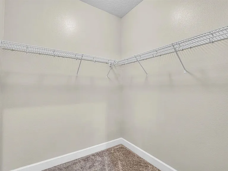 Walk-in closet in the primary