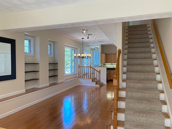 Open concept living/dining room with hardwood flooring and plenty of light!