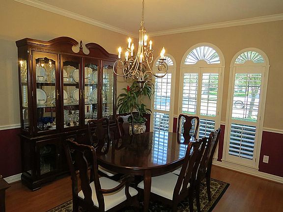 Formal Dining, Wood Laminate Floor, Plantation Shutters, Crown and Chair Moulding