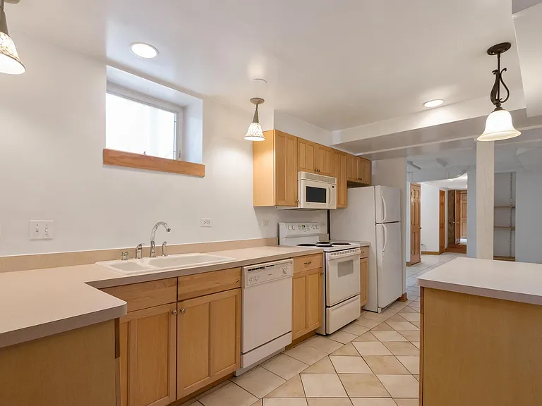 Lots and lots of lights make cooking and cleanup a breeze in this all custom designed kitchen. Solid wood cabinetry. Quarry Stone Tile Floor! Easy to maintain!