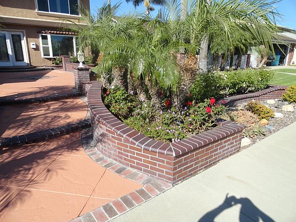 GORGEOUS HARDSCAPE SURROUNDING HOME