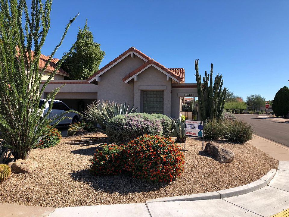 Beautiful low maintenance landscaping on quiet corner lot.