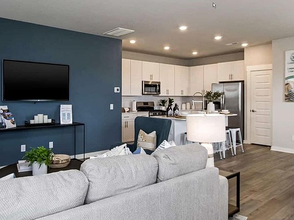 Living room looking into kitchen. Gas stove
