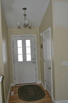 Once inside the entryway opens to the great room.  It features a vaulted ceiling and a good sized coat closet.