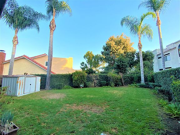 Back yard viewed form covered patio. This is not a shared yard. It is part of the 3 bedroom unit only. The other units have their own yard.