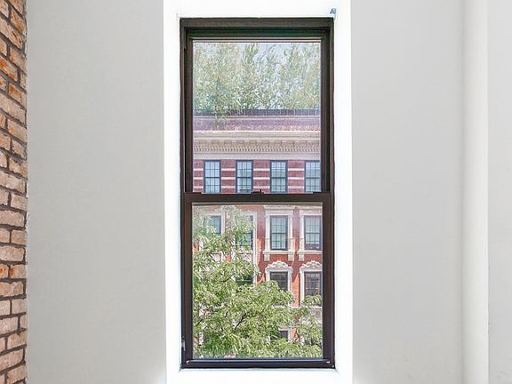 3rd image of 50 E 3rd St APT 1A
