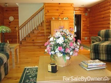 Stairs lead to second floor bedrooms
						:
						opening leads to kitchen