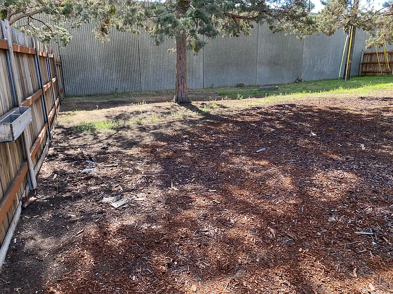 Privacy here with block wall fencing in back of backyard