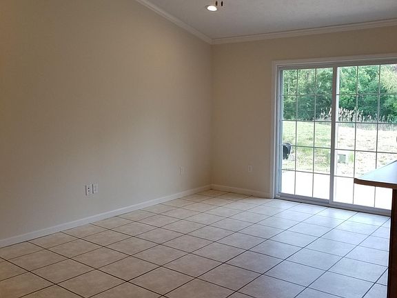 Vaulted Ceiling Dining Room with Sliding Doors to Back Patio