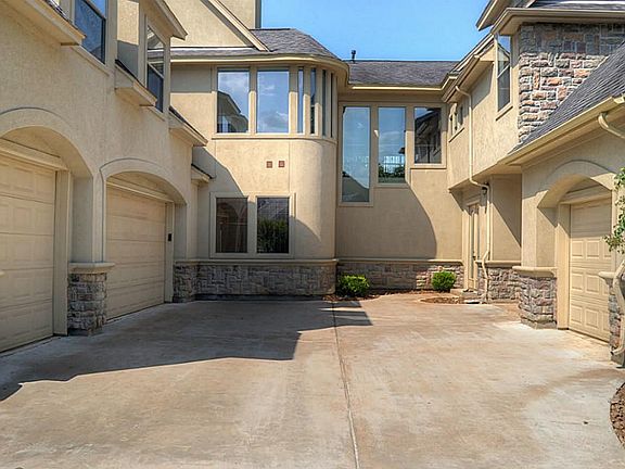The Motor Court is tucked behind the Porte Cochere and provides access to the oversized, split 4-car Garage that is finished with epoxy flooring and even bead-board wainscoting!
