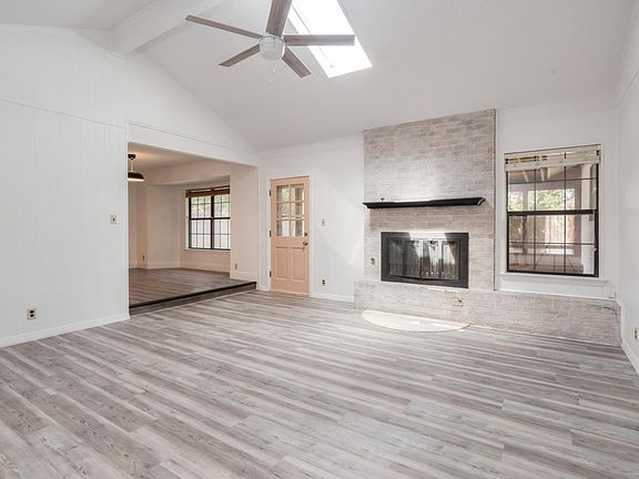 High ceiling living room with skylight
