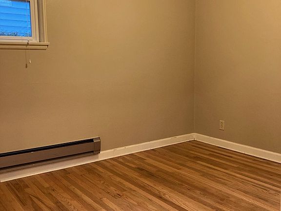Second bedroom - newly refinished hardwood floors.