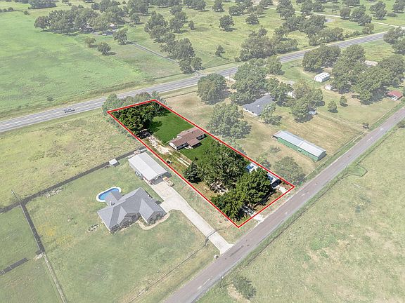 1 full acre with Shop at rear