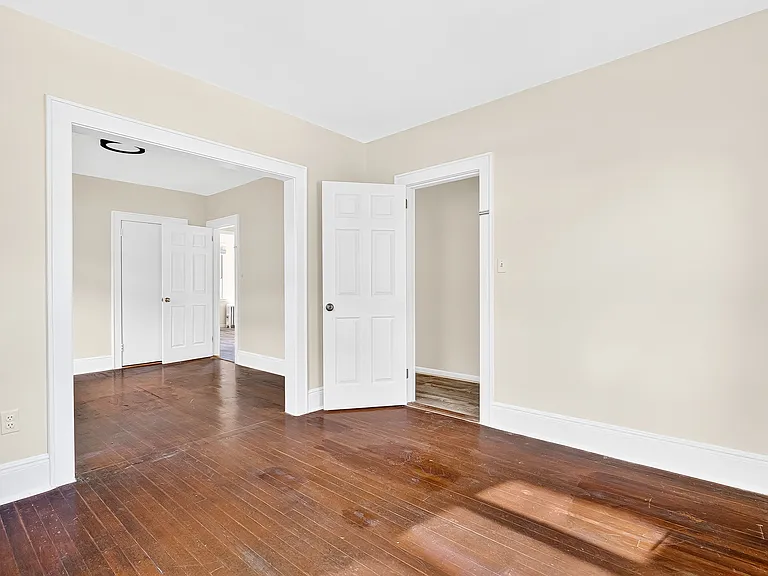 Bedroom with hardwood floors.