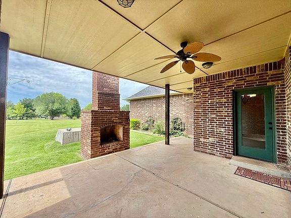 Massive covered porch with comfy cozy time with a fireplace. Electrical outlets outside to set-up a tv or charge devices. A fan keeps those nasty flies away! At least we hope...