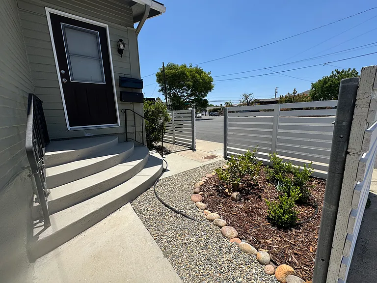 Welcoming, fenced entry. Landscaping maintained by owner.