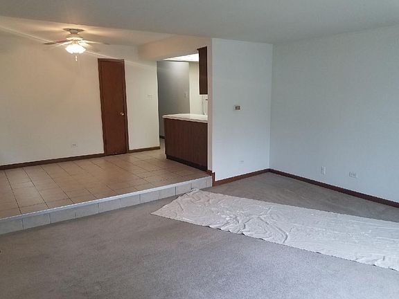 Living Room with tiled step up dining area