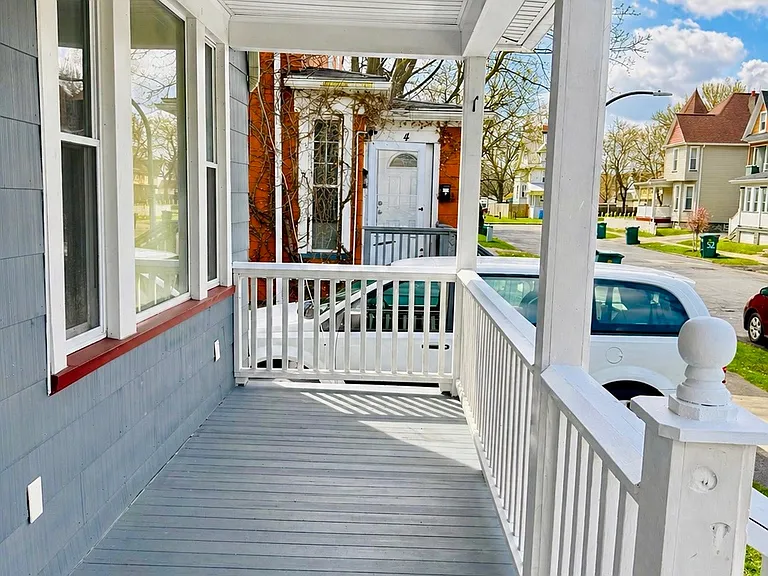 Charming front porch offering a peaceful outdoor space to relax in the mornings or evenings with your family members. Located right beside a convenient two-car driveway, providing both a welcoming entry to the home and easy off-street parking.