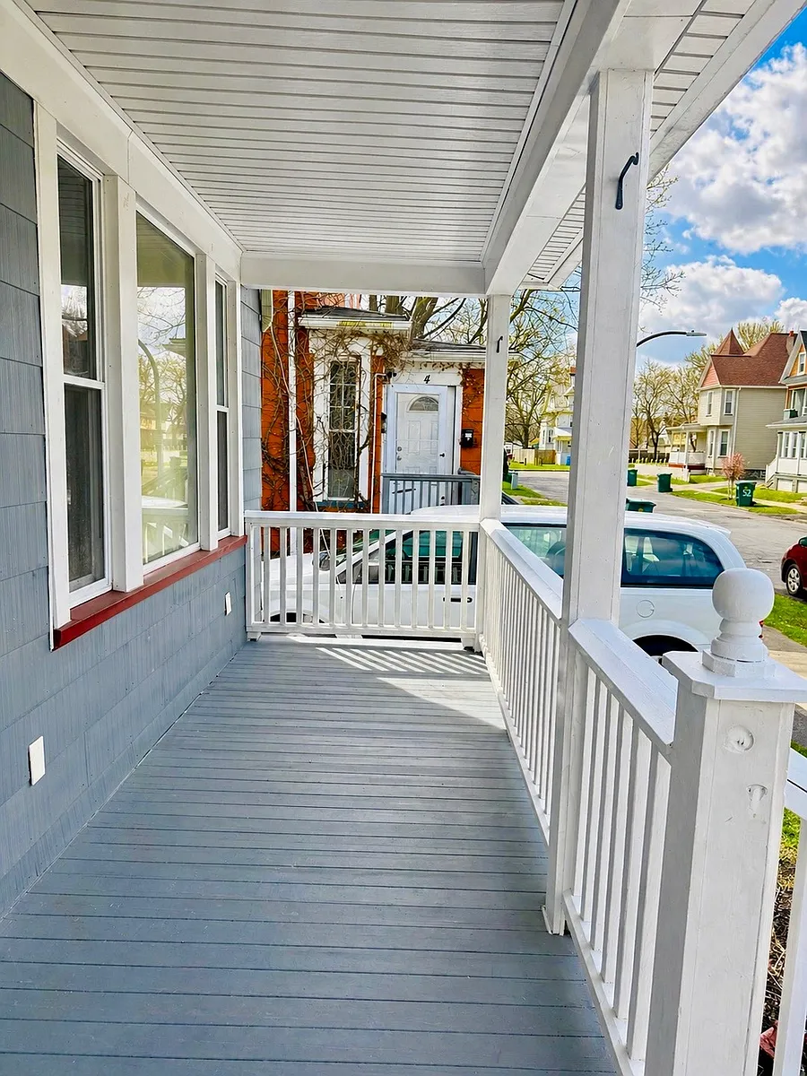 Charming front porch offering a peaceful outdoor space to relax in the mornings or evenings with your family members. Located right beside a convenient two-car driveway, providing both a welcoming entry to the home and easy off-street parking. - 6 Broezel St
