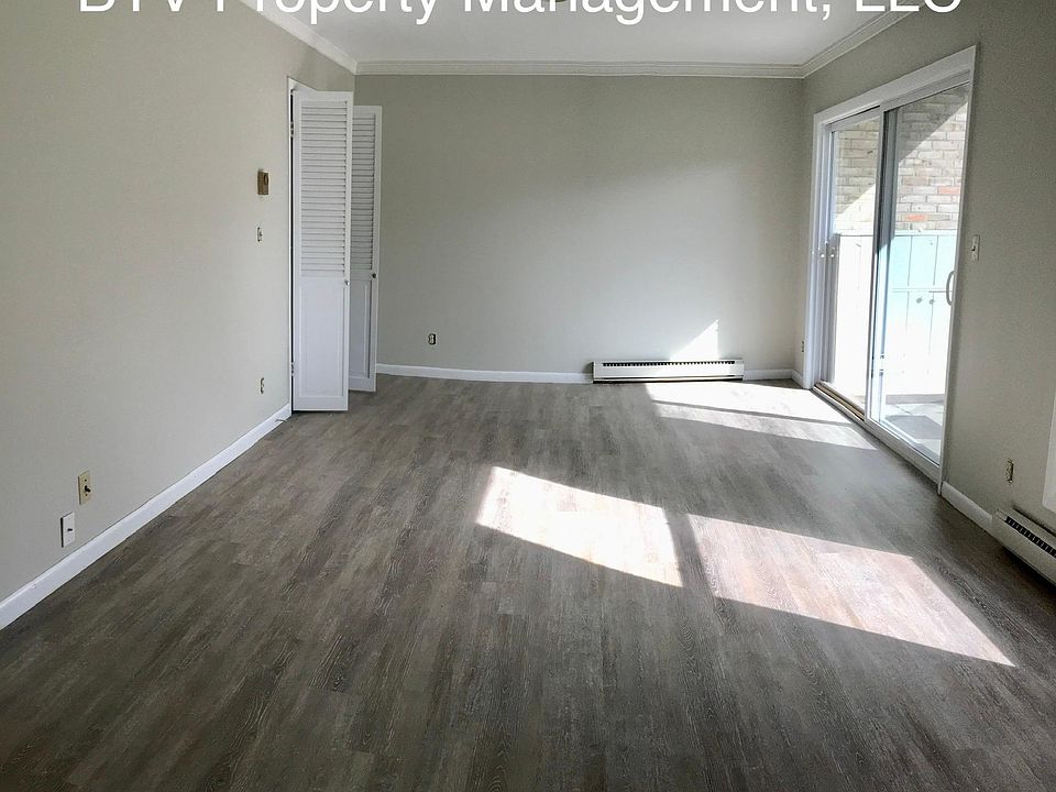 Living towards dining and sliding doors to patio
