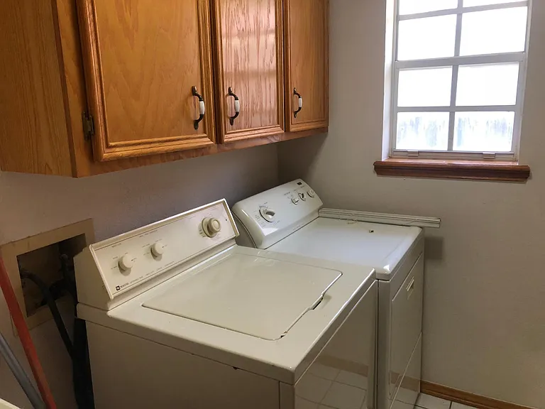 Laundry room includes washer and dryer