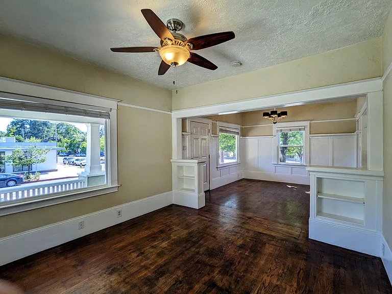 Original wood floors and built in cabinetry retain period charm and elegance.