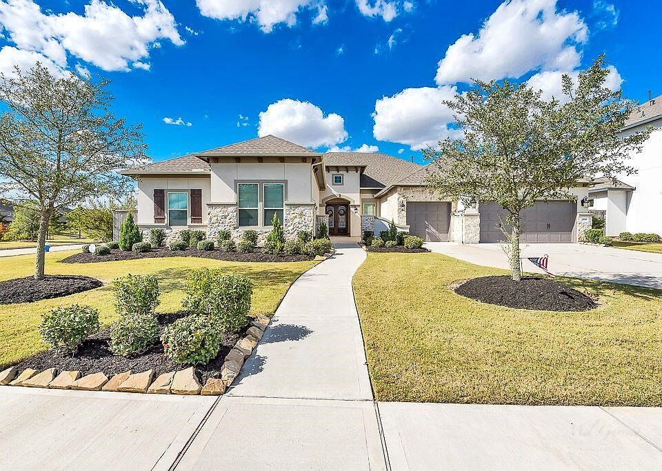 Beautiful stone and stucco front elevation.