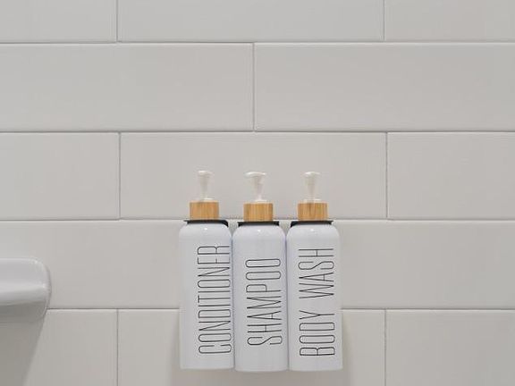 Bathroom includes refillable body wash, shampoo, and conditioner for your convenience.